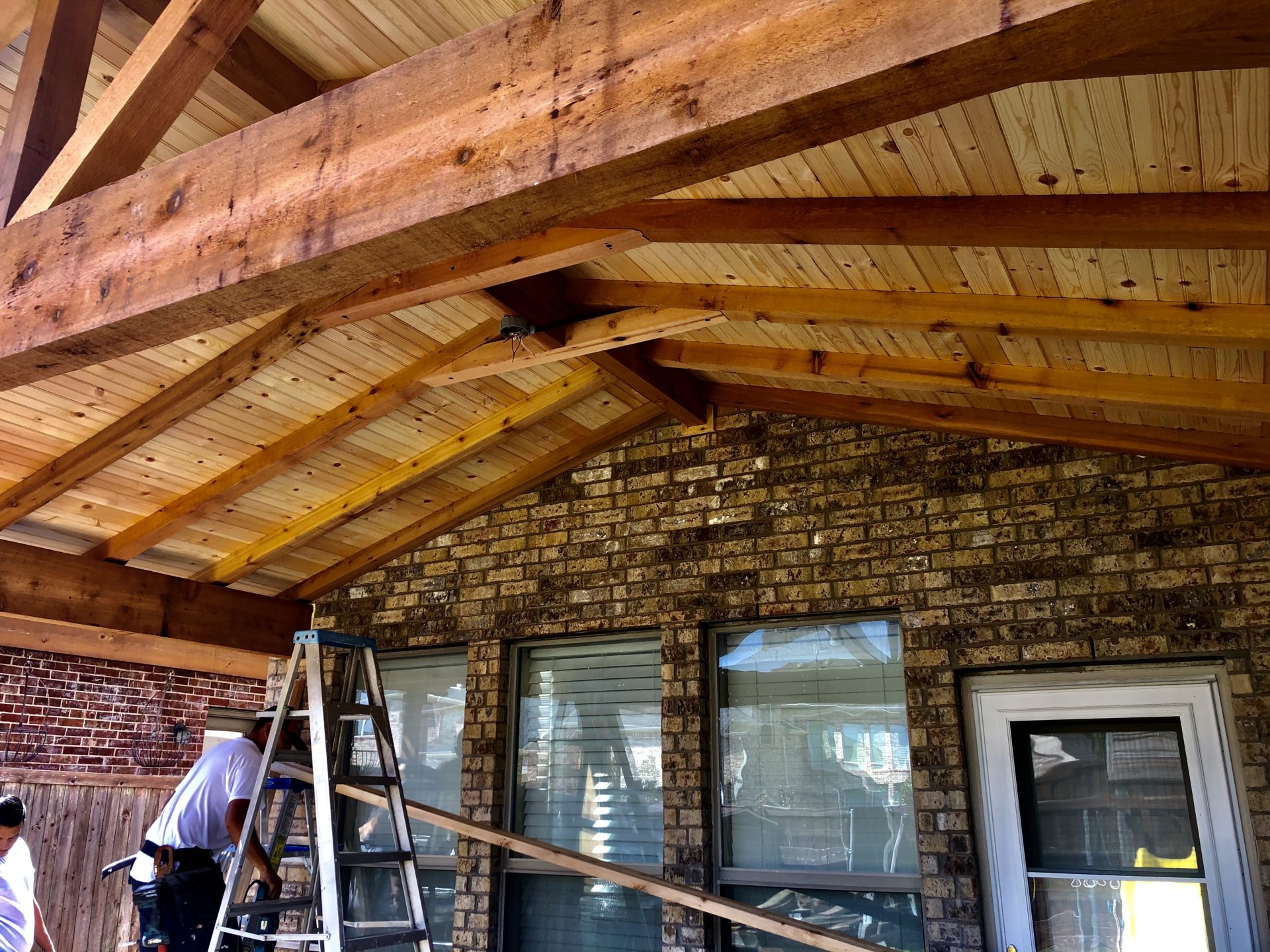 Brand new, pavilion style patio roof added on to a home in Dallas, TX.