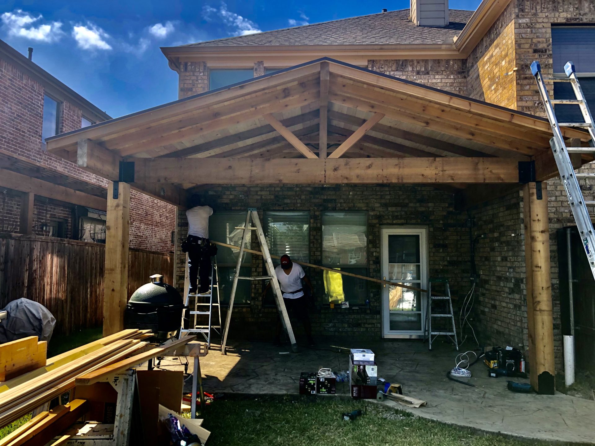 Construction on pavilion patio roof by the Jenkins Roofing team in the backyard of a home in Dallas, TX.