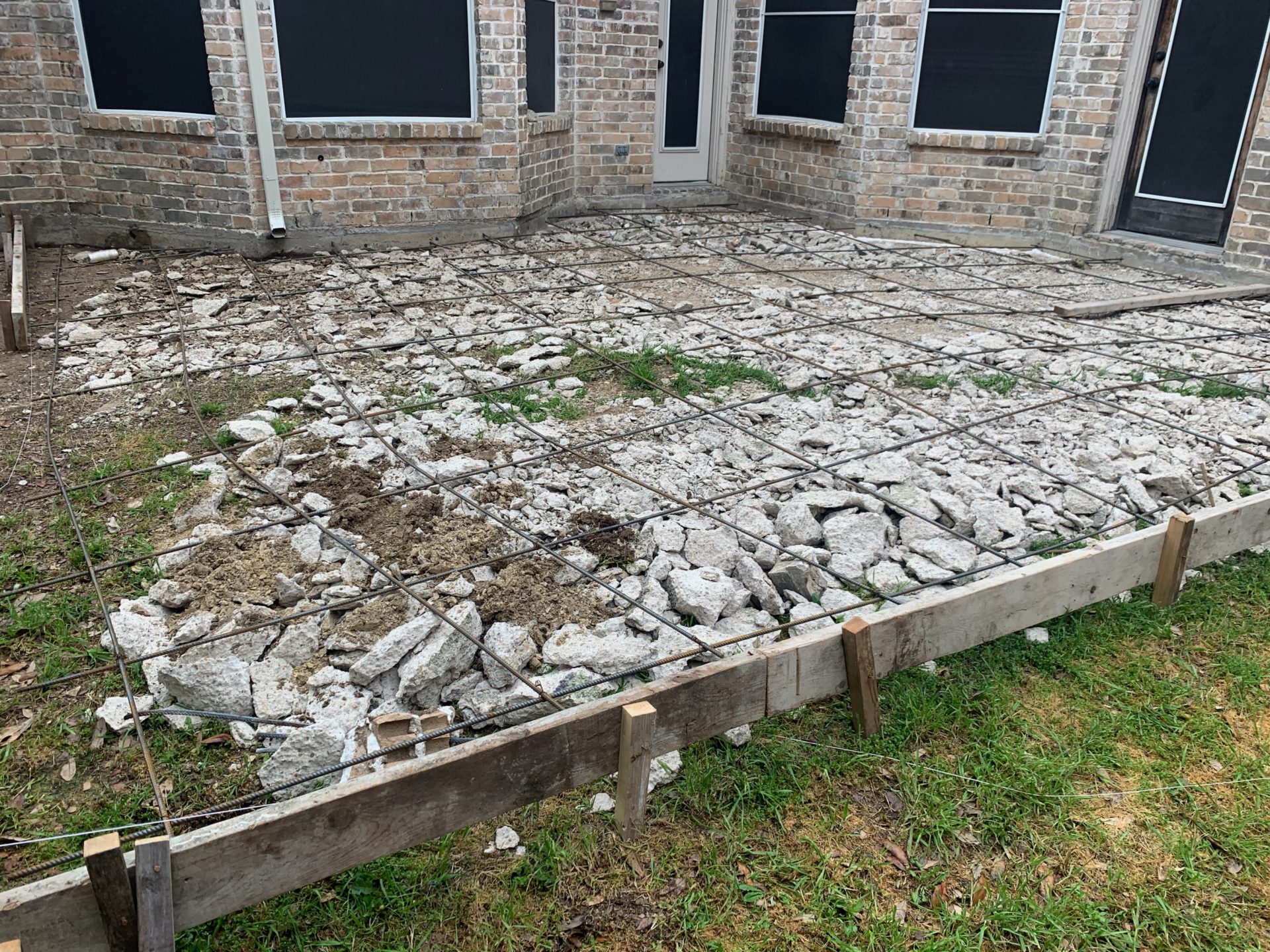 Foundation for patio concrete slab before concrete is laid for home in Dallas Fort Worth Texas patio construction job.
