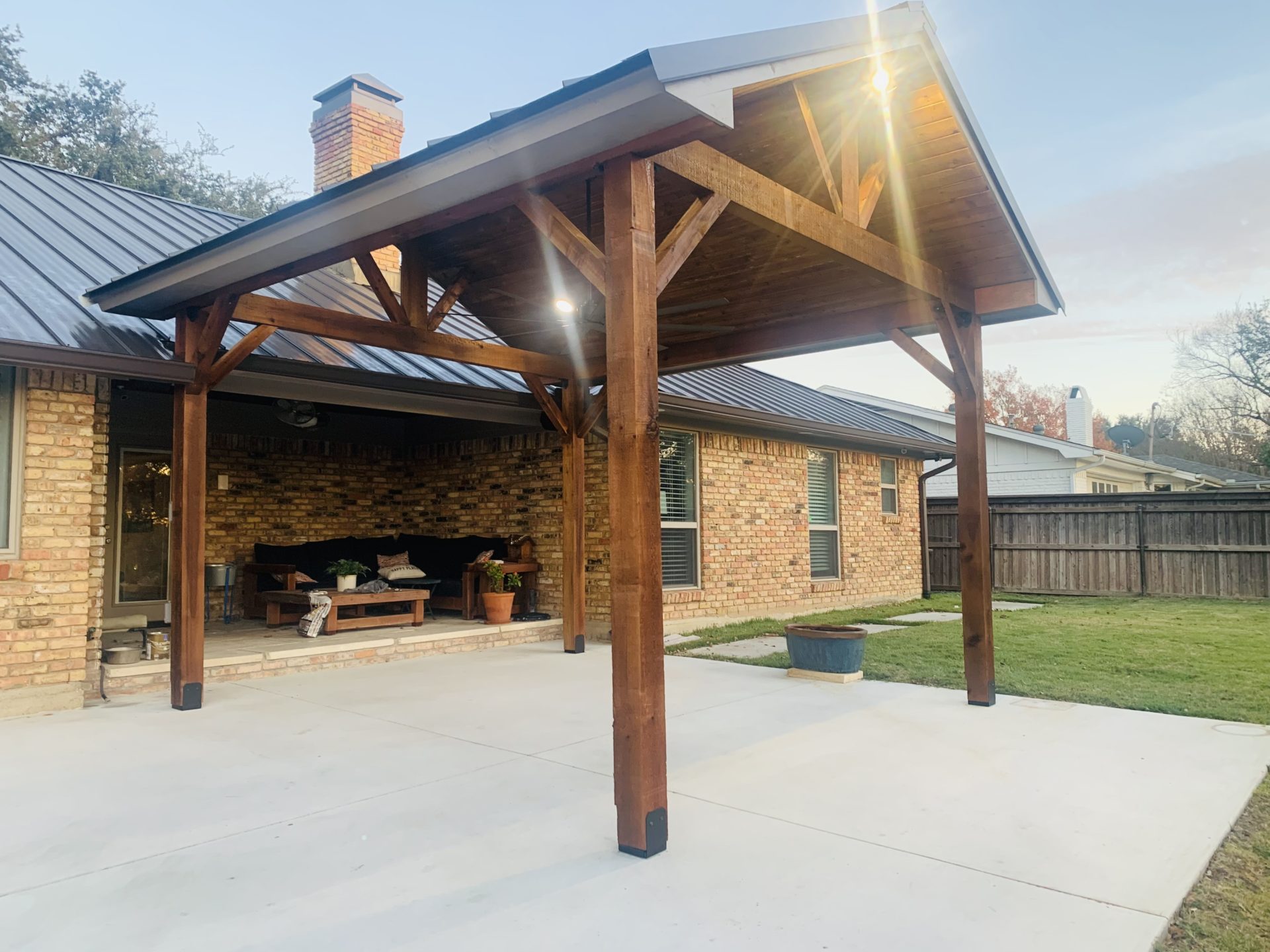 Side angle of professional outdoor pavilion patio cover build in Arlington, TX by Jenkins Roofing and Construction
