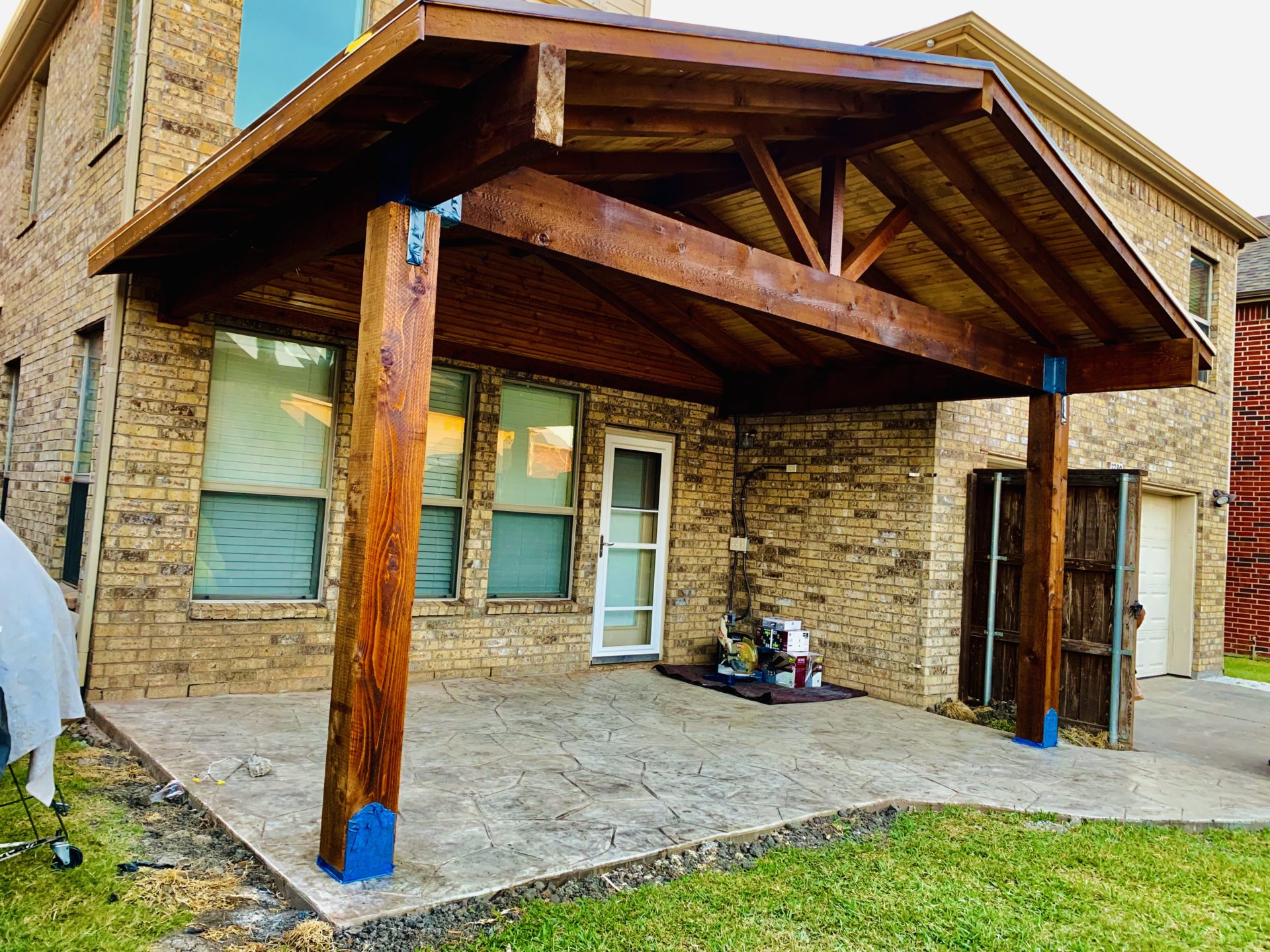 Side angle of completed pavilion patio roof job by the Jenkins Roofing team in the backyard of a home in Dallas, TX.