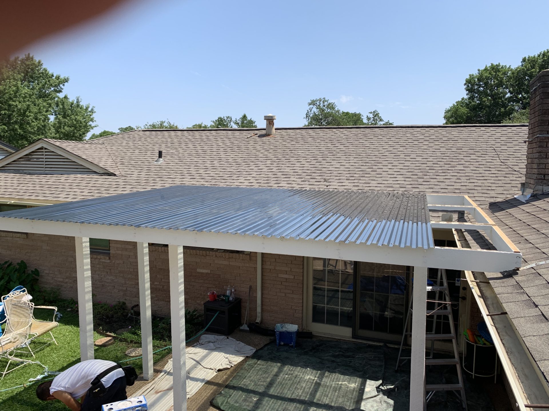 Pergola patio cover under construction that will extend outdoor living space for home in Arlington, TX
